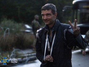 This handout photograph taken and released by Security Service of Ukraine on September 22, 2022 shows Ukrainian prisoner of war Mykhailo Dianov reacting after a his exchange in Chernigiv region.