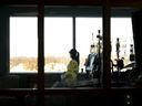 A registered nurse takes a moment to look outside while attending to a ventilated COVID-19 patient in the intensive care unit at the Humber River Hospital during the COVID-19 pandemic in Toronto on Jan. 25, 2022. 