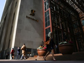 Pedestrians walk in the financial district in Toronto on Sept. 29, 2021.