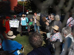 Terry Dance-Bennink speaks to seniors during a rally in support of a senior-friendly park at the former S.J. Willis Junior High School field in Victoria, B.C., on Tuesday, Sept. 27, 2022.