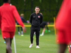 Canadian national men's soccer team head coach John Herdman watches a training session for a CONCACAF Nations League match against Curacao, in Vancouver, on Tuesday, June 7, 2022.