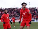 Canada's Tajon Buchanan celebrates scoring against Jamaica in a FIFA World Cup qualifying game at BMO Field on March 27, 2022.
