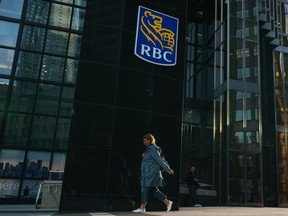 A person walks past RBC signage in Toronto on Tuesday, Sept. 20, 2022.