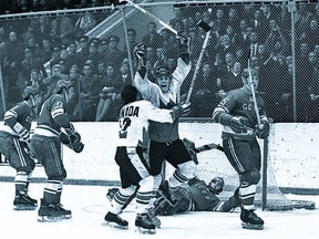 Paul Henderson scores the Summit Series winning goal against the Soviet Union.