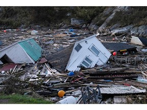 Structures float in the water in the aftermath of Hurricane Fiona in Rose Blanche, Newfoundland, Sept. 25, 2022.