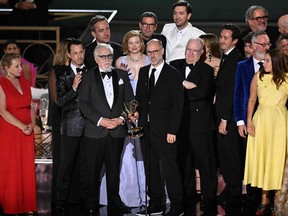 British screenwriter Jesse Armstrong, centre, accepts the award for Outstanding Drama Series for "Succession" onstage during the 74th Emmy Awards at the Microsoft Theater in Los Angeles, Calif., on Sept. 12, 2022.