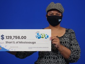 Shari Sahadeo with her Lotto Max winnings.