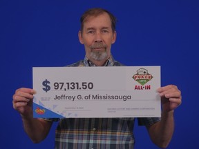 Jeffrey Gurczenski of Mississauga holds his Poker Lotto All-In winnings.