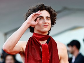 Timothee Chalamet poses on the red carpet for the premiere of his film, "Bones and All," at the Venice Film Festival, Sept. 2, 2022.