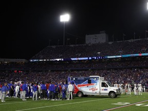 Players gather around an ambulance on the field after an injury to Bills' Dane Jackson during the first half of an NFL game against the Titans in Orchard Park, N.Y., Monday, Sept. 19, 2022.