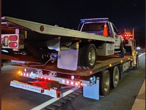 A tow truck driver called to crash on the QEW allegedly turned up drunk, according to the OPP.