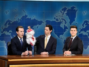 Alex Moffat, left, as Eric Trump, alongside Mikey Day as Donald Trump Jr. and Colin Jost during "Weekend Update" on "Saturday Night Live."