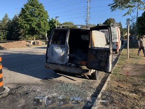 A burned out van is pictured on Glen Erin Dr., south of Folkway Dr., in Mississauga.