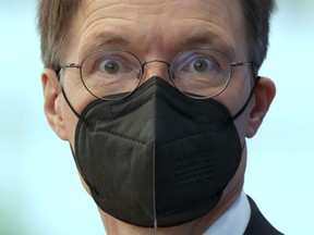 German Health Minister Karl Lauterbach arrives for a press conference in Berlin, Friday, Aug. 12, 2022.