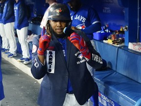 Toronto Blue Jays designated hitter Vladimir Guerrero Jr. celebrates in the dugout after his solo home run against the Tampa Bay Rays during the first inning at Rogers Centre on Sept. 14, 2022.