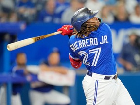Vladimir Guerrero Jr. hits a double against the Chicago Cubs.