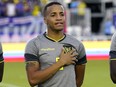 Ecuador's Byron Castillo stands for the national anthem before the team's international friendly soccer match against Cape Verde, Saturday, June 11, 2022, in Fort Lauderdale, Fla.