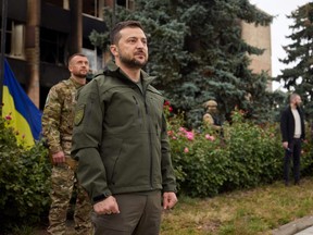 Ukraine's President Volodymyr Zelenskyy attends a flag rising ceremony in the town of Izium recently liberated by the Ukrainian Armed Forces during a counteroffensive operation, amid Russia's attack on Ukraine, in Kharkiv region, Ukraine Sept. 14, 2022.