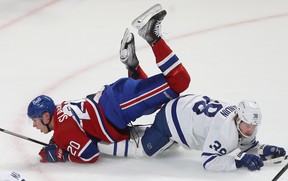 Canadiens’ Juraj Slafkovsky (left) is tripped by Maple Leafs’ Rasmus Sandin during first-period action in Montreal on Wednesday, Oct. 12, 2022. PIERRE OBENDRAUF/POSTMEDIA NETWORK