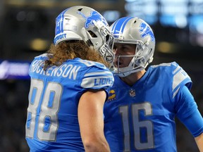 Detroit Lions' T.J. Hockenson (left) celebrates with Jared Goff after a two-point conversion against the Seattle Seahawks.