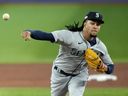 Seattle Mariners starting pitcher Luis Castillo works during first inning MLB postseason wildcard baseball action against the Toronto Blue Jays.