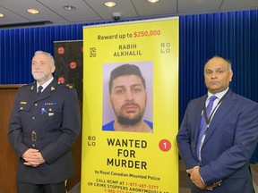 Coquitlam RCMP’s Darren Carr with CFSEU Chief Manny Mann at Surrey news conference on Oct. 18, 2022. A $250,000 reward has been offered for the capture of fugitive killer Robby Alkhalil.