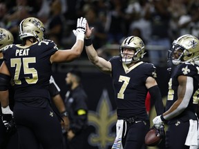 Taysom Hill of the New Orleans Saints reacts after scoring a touchdown in the second quarter of the game against the Seattle Seahawks.