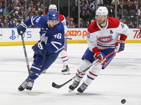 Alex Steeves of the Toronto Maple Leafs skates after a puck against Joel Armia of the Montreal Canadiens during an NHL pre-season game at Scotiabank Arena on September 28, 2022 in Toronto, Ontario, Canada.