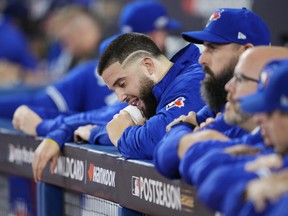 A dejected Alek Manoahof the Blue Jays looks on from the dugout in the second inning yesterday after spotting the Mariners a 3-0 lead in the first of Game 1 at the Rogers Centre.