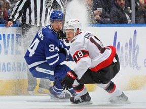 Tim Stutzle of the Ottawa Senators skates against Auston Matthews of the Toronto Maple Leafs during an NHL game at Scotiabank Arena on October 15, 2022 in Toronto, Ontario, Canada.