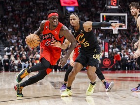 Pascal Siakam of the Toronto Raptors drives against Isaac Okoro of the Cleveland Cavaliers during the second half at Scotiabank Arena on October 19, 2022 in Toronto, Canada.