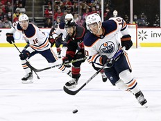 Derek Ryan of the Edmonton Oilers moves the puck against the Carolina Hurricanes during their game at PNC Arena on February 27, 2022 in Raleigh, North Carolina.