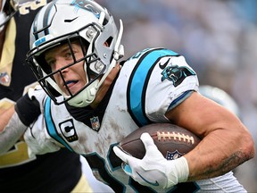 Christian McCaffrey of the Carolina Panthers runs with the ball against the New Orleans Saints during the fourth quarter at Bank of America Stadium on September 25, 2022 in Charlotte, North Carolina.