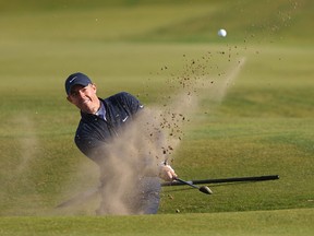 Rory McIlroy of Northern Ireland plays a shot from a bunker on the 14th hole on Day Four of the Alfred Dunhill Links Championship on the Old Course St. Andrews on October 02, 2022 in St Andrews, Scotland.