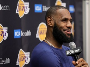 LeBron James of the Los Angeles Lakers smiles during a news conference after a preseason game against the Phoenix Suns at T-Mobile Arena on October 05, 2022 in Las Vegas, Nevada.