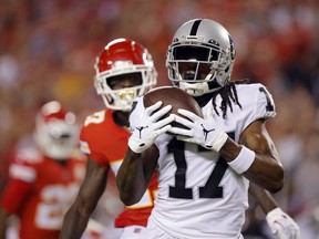 Davante Adams #17 of the Las Vegas Raiders catches a long pass for a touchdown as Rashad Fenton #27 of the Kansas City Chiefs defends during the 1st quarter of the  at Arrowhead Stadium on October 10, 2022 in Kansas City, Missouri.