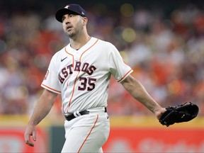 Justin Verlander of the Houston Astros reacts against the Seattle Mariners during the third inning in game one of the American League Division Series at Minute Maid Park on October 11, 2022 in Houston, Texas.
