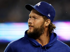 Clayton Kershaw #22 of the Los Angeles Dodgers looks on during game one of the National League Division Series against the San Diego Padres at Dodger Stadium on October 11, 2022 in Los Angeles, California.