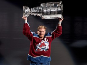 Gabriel Landeskog of the Colorado Avalanche skates with the Stanley Cup at a ceremony  celebrating their NHL Championship before their home opener against the Chicago Blackhawks at Ball Arena on October 12, 2022 in Denver, Colorado.