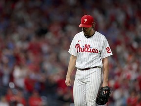 Aaron Nola #27 of the Philadelphia Phillies walks back to the dugout after being relieved during the seventh inning against the Atlanta Braves in game three of the National League Division Series at Citizens Bank Park on October 14, 2022 in Philadelphia, Pennsylvania.