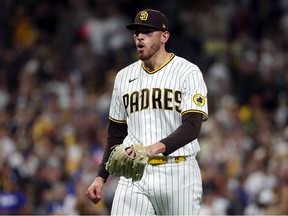 Joe Musgrove of the San Diego Padres reacts after striking out Will Smith of the Los Angeles Dodgers (not pictured) during the fifth inning in game four of the National League Division Series at PETCO Park on October 15, 2022 in San Diego, California.