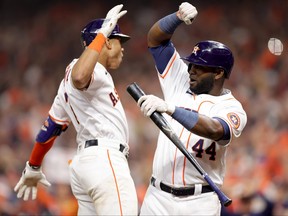 Jeremy Pena of the Houston Astros celebrates a home run with Yordan Alvarez during the seventh inning against the New York Yankees in game one of the American League Championship Series at Minute Maid Park on October 19, 2022 in Houston, Texas.