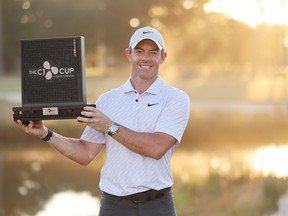 Rory McIlroy of Northern Ireland celebrates with the trophy after winning during the final round of the CJ Cup at Congaree Golf Club on October 23, 2022 in Ridgeland, South Carolina.