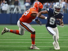 KaVontae Turpin of the Dallas Cowboys runs against Roquan Smith of the Chicago Bears during the third quarter at AT&T Stadium on October 30, 2022 in Arlington, Texas.