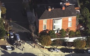 Members of law enforcement work outside the home of U.S. House Speaker Nancy Pelosi after her husband Paul Pelosi was violently assaulted during a break-in at their house in San Francisco, Calif., in this screen grab taken from video on Oct. 28, 2022.