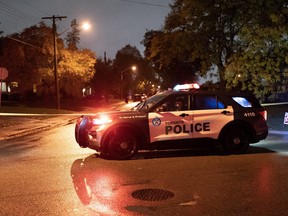 Police block the road at the scene of a shooting where a suspect shot at officers in Toronto, on Tuesday, Oct 18, 2022.
