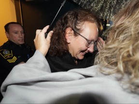 Kimberly Polman smiles as she's greeted by family members after being released from custody at provincial court, in Chilliwack, B.C., on Thursday, Oct. 27, 2022.