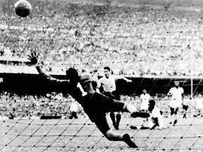 File photo taken 16 July 1950 at the Maracana stadium in Rio de Janeiro, when Uruguayan Juan Alberto Schiaffino (C) scores the first goal of his team against Brazil, during the 1950 FIFA World Cup final.
