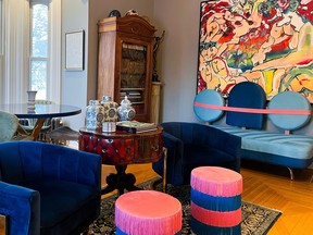 Cheeky pinks and bold blues make for a cheery sitting room.