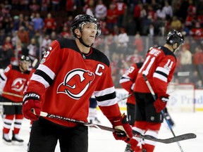 Andy Greene and Brian Boyle of the New Jersey Devils skate off the ice after losing 3-2 in overtime to the Edmonton Oilers on November 9, 2017 at Prudential Center in Newark, New Jersey.
